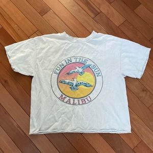 This is a brandy melville top. It is one size fits all. It is a off white color.